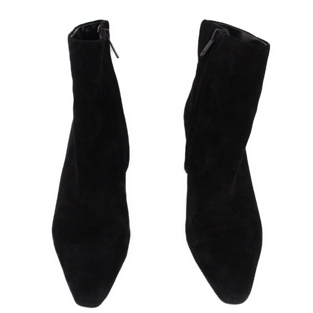 Pair of black suede ankle booties with side profile and pull-on opening