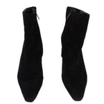 Pair of black suede ankle booties with side profile and pull-on opening
