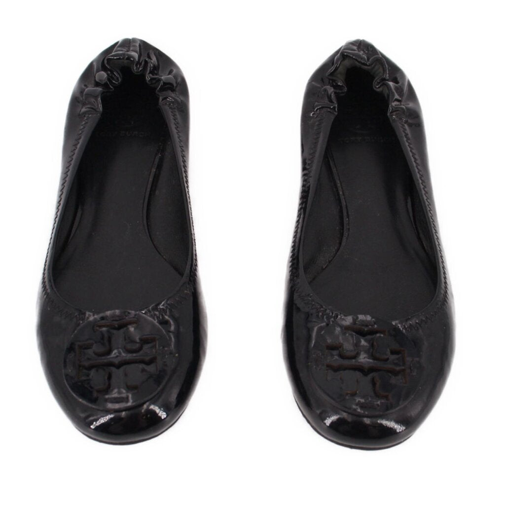 Pair of black patent ballet flats with bow-like collar and logo embossed toe