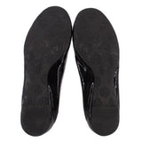 Patent flat outsoles with repeating logo pattern on dark rubber soles