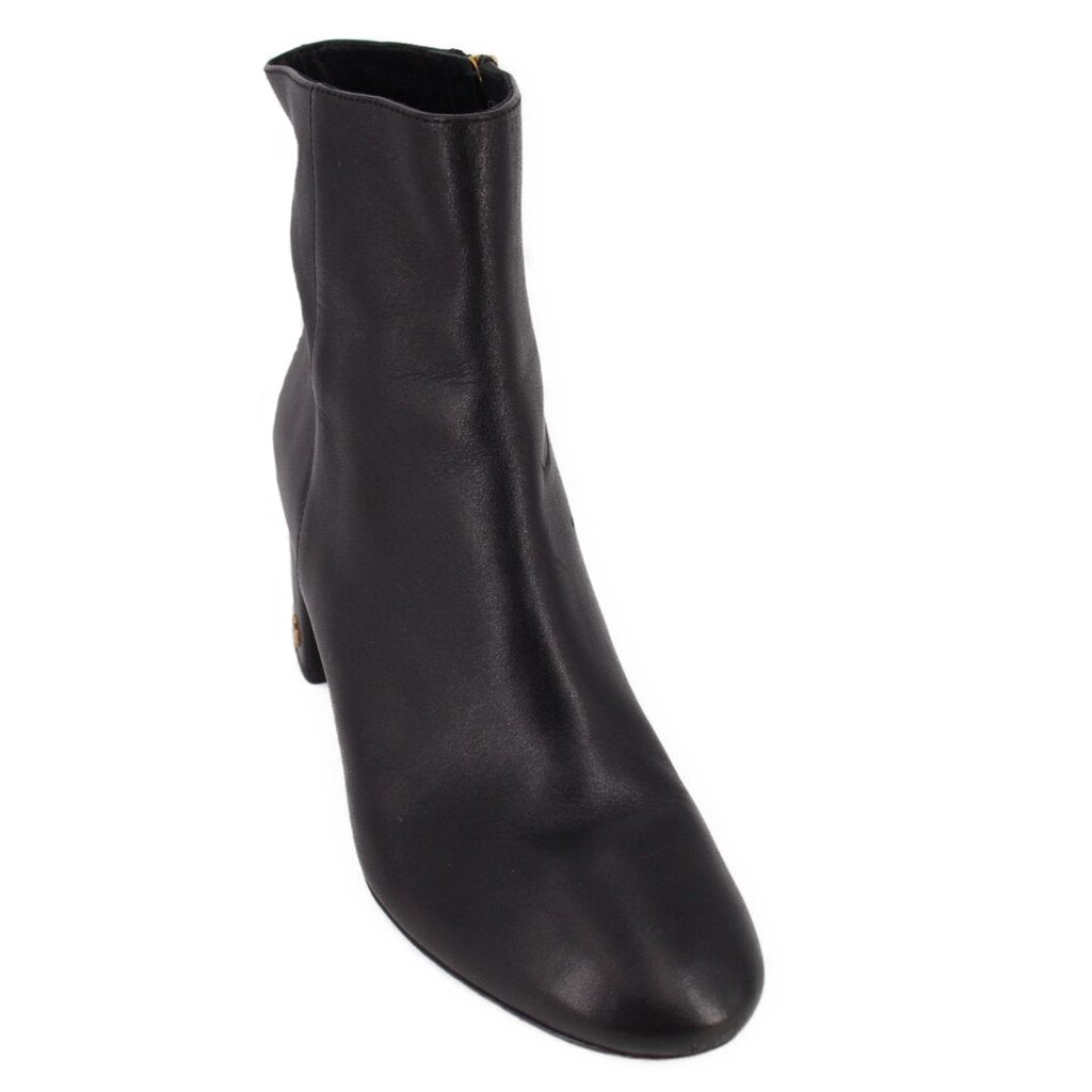 Black leather ankle boot with short shaft and round toe.