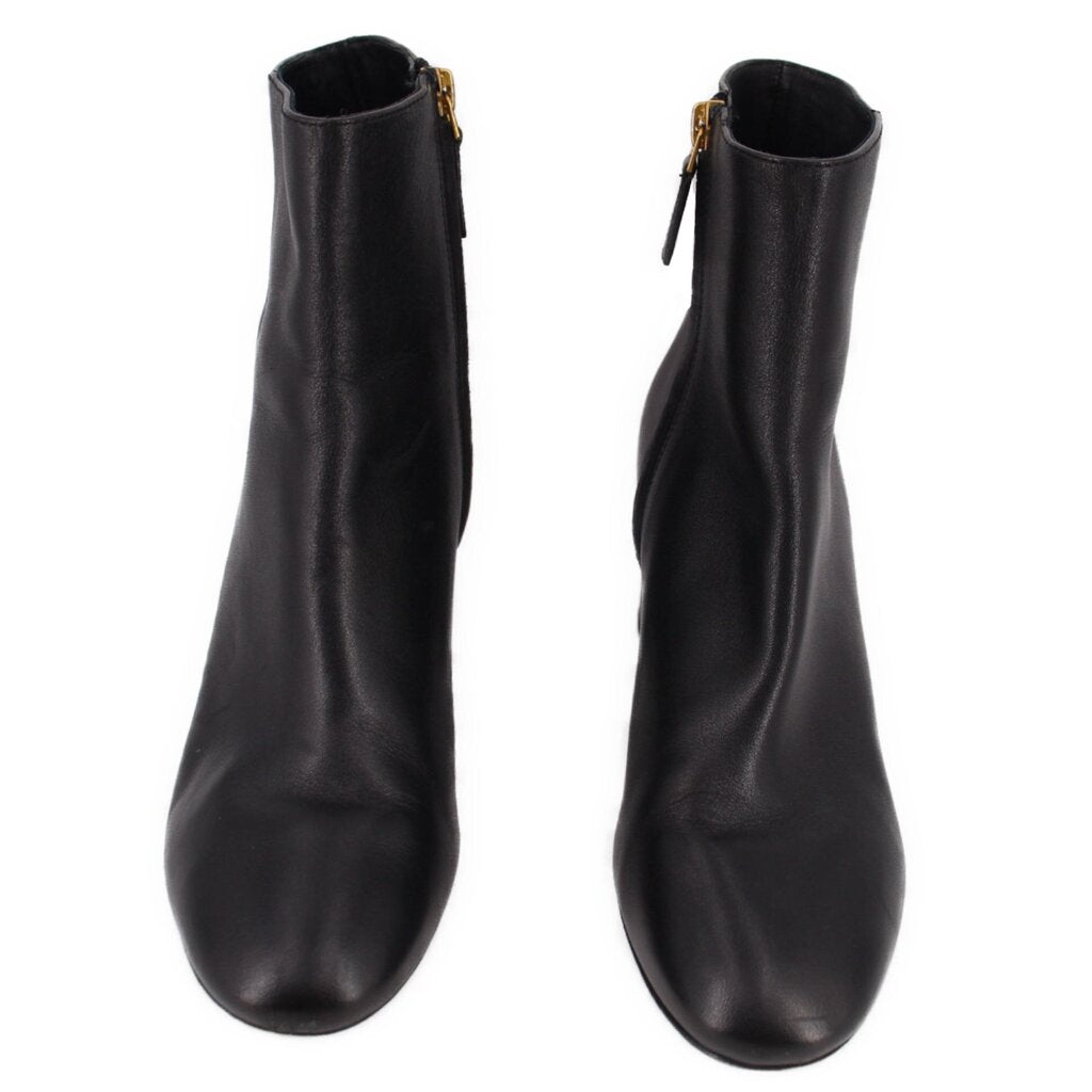 Black leather ankle boot pair with side zippers and gold-tone pulls.