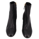 Black leather ankle boot pair with side zippers and gold-tone pulls.