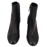 Black leather ankle boot pair with side zippers and gold-tone pulls.