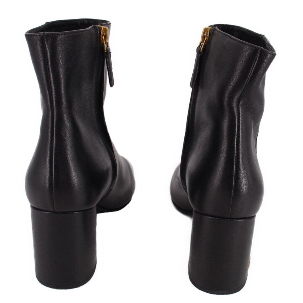 Black leather ankle boot pair, back view of short heel and side zipper.