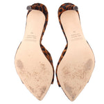 Leopard-print heeled mules with tan insoles; visible wear on footbeds
