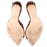 Leopard-print heeled mules with tan insoles; visible wear on footbeds