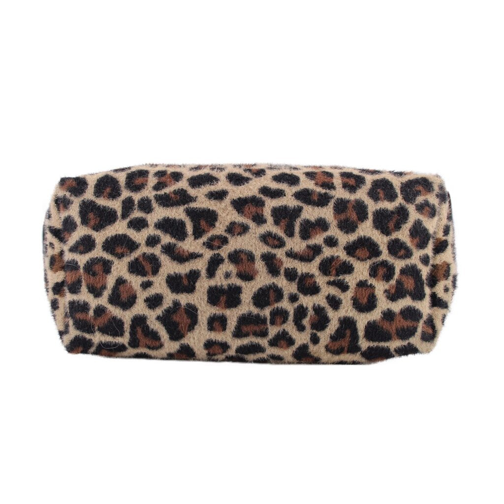Bottom of the leopard-print tote showing its wide rectangular base