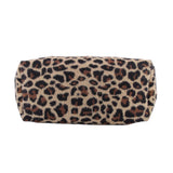 Bottom of the leopard-print tote showing its wide rectangular base