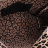 Inside of the leopard-print tote with dark patterned lining and black strap