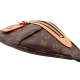 LOUIS VUITTON monogram belt bag close-up with tan leather pocket strap and zip pull.