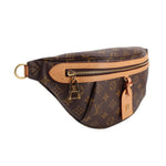 LOUIS VUITTON monogram belt bag with front zipper and leather tab, adjustable strap.