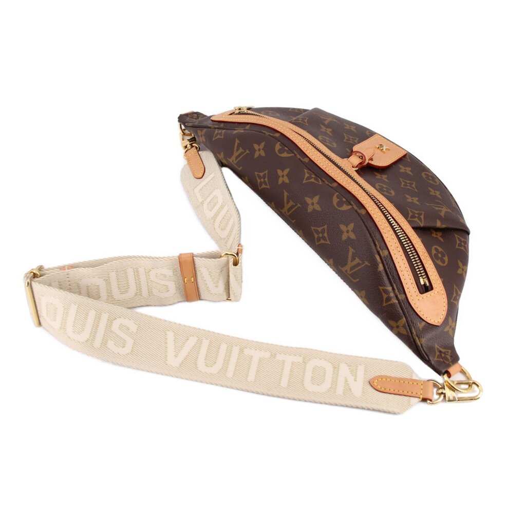 LOUIS VUITTON monogram belt bag with adjustable strap, tan canvas, gold-tone rings.
