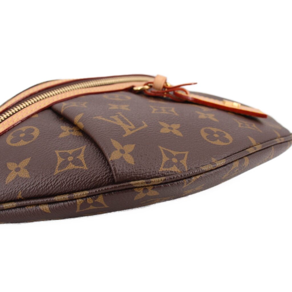 LOUIS VUITTON monogram belt bag close-up of leather trim along the edge seam.