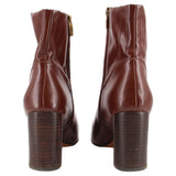 Brown ankle boots with side zippers and stacked block heel, back view