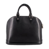 Black structured leather dome bag with dual top handles and front leather strap accents.