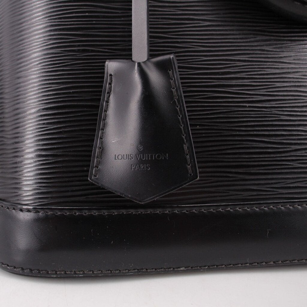 Black interior leather pocket tag with LOUIS VUITTON Paris branding.