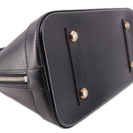 Black leather side panel with metal studs and stitched trim near the zipper.