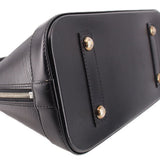 Black leather side panel with metal studs and stitched trim near the zipper.