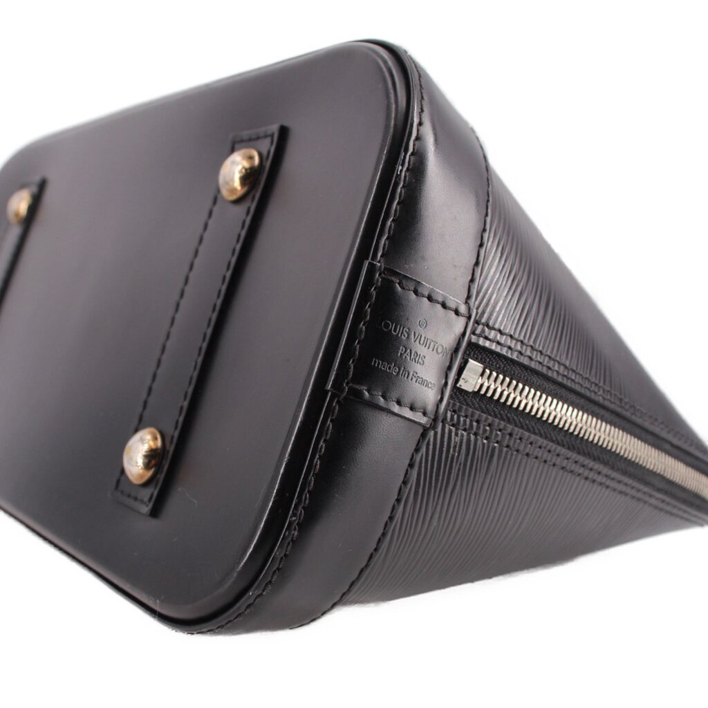 Black leather corner with top zipper track and metal pull hardware detail.