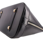Black leather corner with top zipper track and metal pull hardware detail.