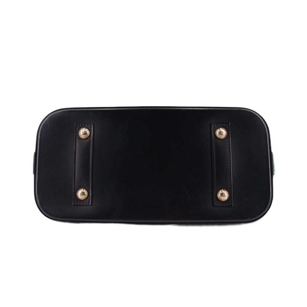 Black leather base panel with metal corner studs and reinforced sides.