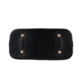 Black leather base panel with metal corner studs and reinforced sides.