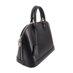 Black structured leather top-handle bag, side view with silver zipper hardware detail.