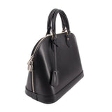 Black structured leather top-handle bag, side view with silver zipper hardware detail.
