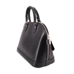Black structured leather dome bag with top handles and side zipper pocket detail.