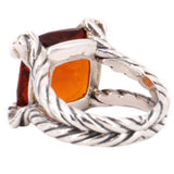 David Yurman ring side view showing twisted silver band and garnet setting