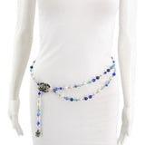 Long beaded belt worn at the waist, with a jeweled side accent and hanging end