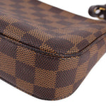Louis Vuitton Damier Ebene corner detail with dark check pattern and rounded trim