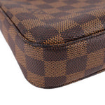 Louis Vuitton Damier Ebene stitched corner detail with check pattern and rounded edge