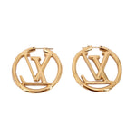 Gold LOUIS VUITTON hoop earrings featuring LV monogram and smooth clasp detail.