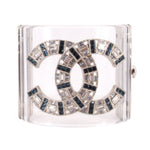 CHANEL clear cuff bracelet with interlocking logo and blue, black, and clear jeweled accents