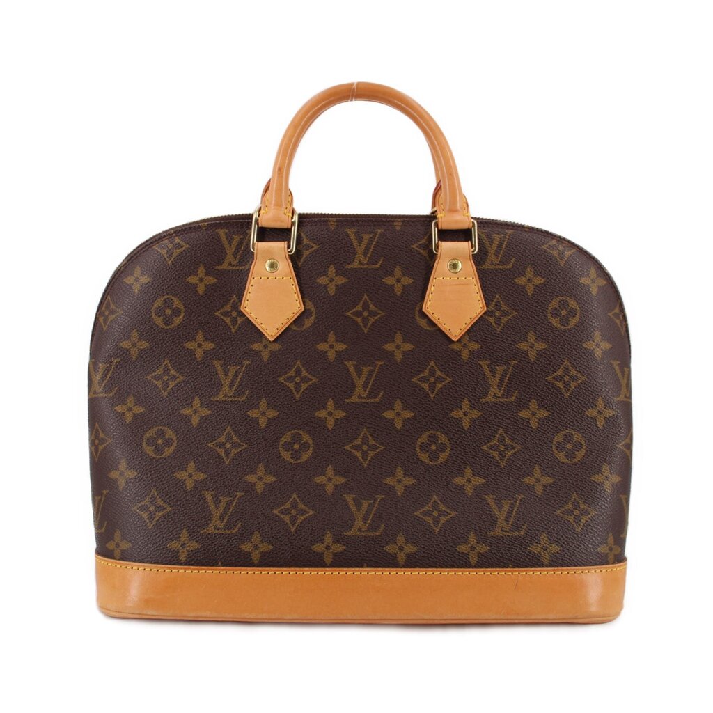 Monogram handle bag with tan leather handles and trim, zip top closure