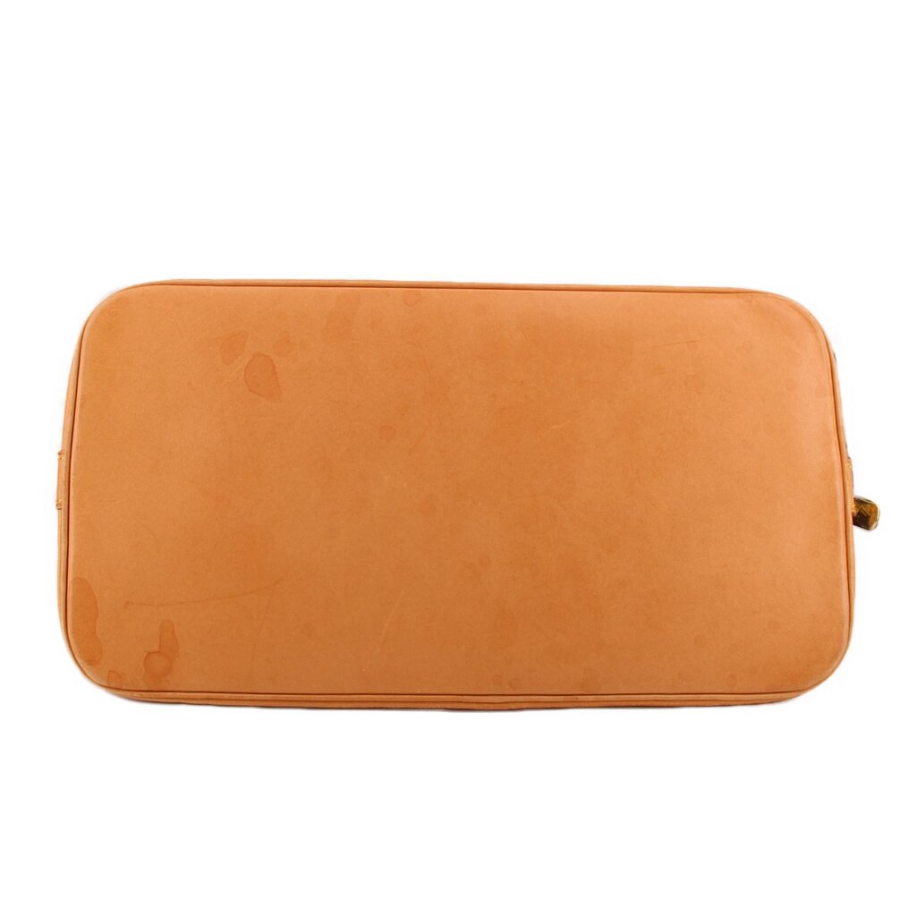 Tan leather shoulder bag with smooth exterior and rounded top corners