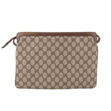 Brown GG canvas shoulder bag with top handle and flap front pocket