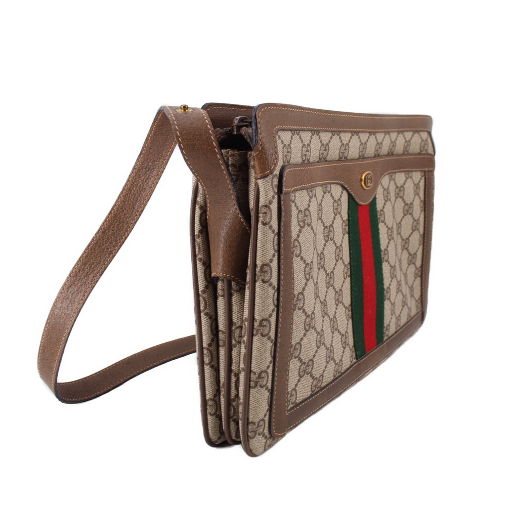 Brown GG canvas crossbody bag with leather strap and Web stripe detail