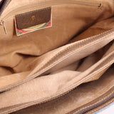 Beige suede-lined interior compartment with fabric logo patch