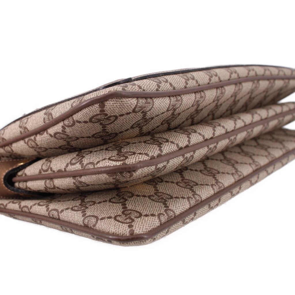 Brown GG canvas bag interior opening with leather edges and lining