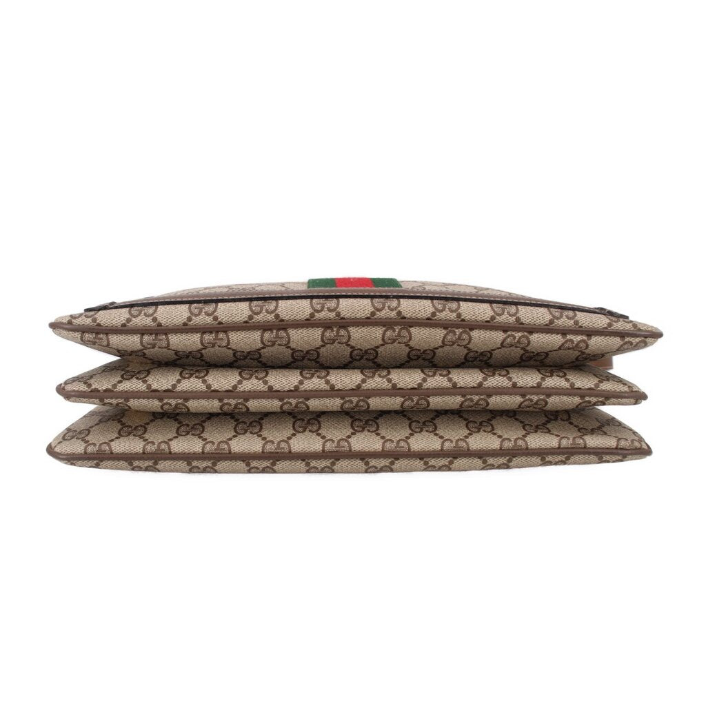 Brown GG canvas shoulder bag, side view showing layered thickness