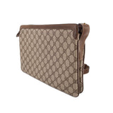 Brown GG canvas shoulder bag with leather trim and adjustable side strap