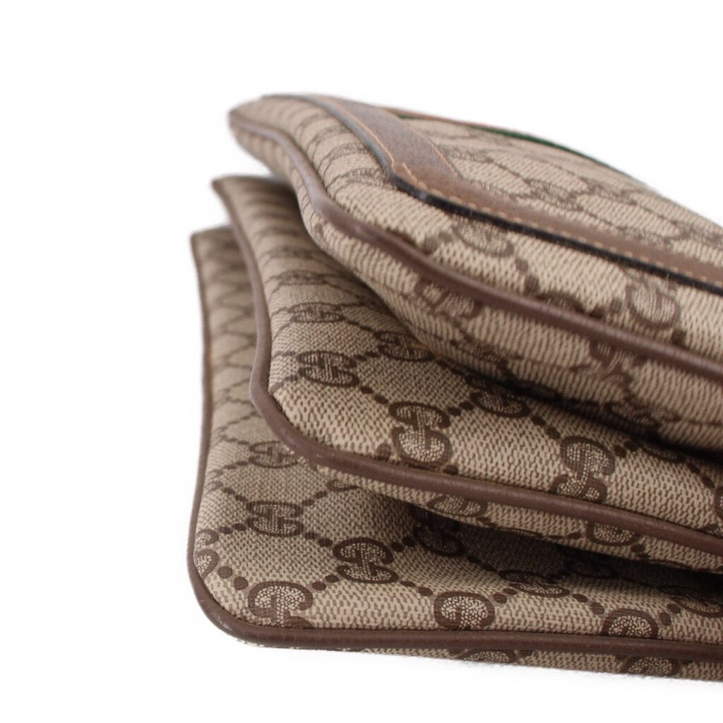 Brown GG canvas bag flap and interior lining with stitched leather trim
