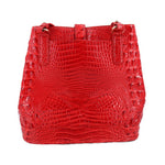 Red croc-embossed bucket shoulder bag with front snap pockets and drawstring