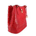 Red croc-embossed bucket shoulder bag with adjustable strap and top handle