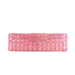 Cupid pink croc-embossed bag bottom panel with center seam detail.