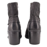Black leather harness boots, back view with heel and strap hardware