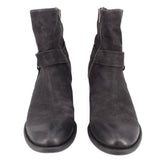 Black leather harness ankle boots with strap detail and side zipper